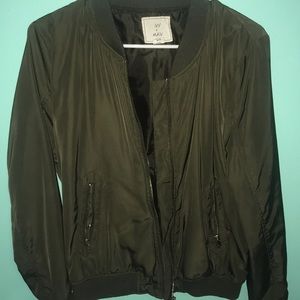Tilly's dark green jacket